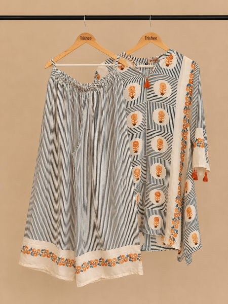 White and blue co-ord set with orange flowers